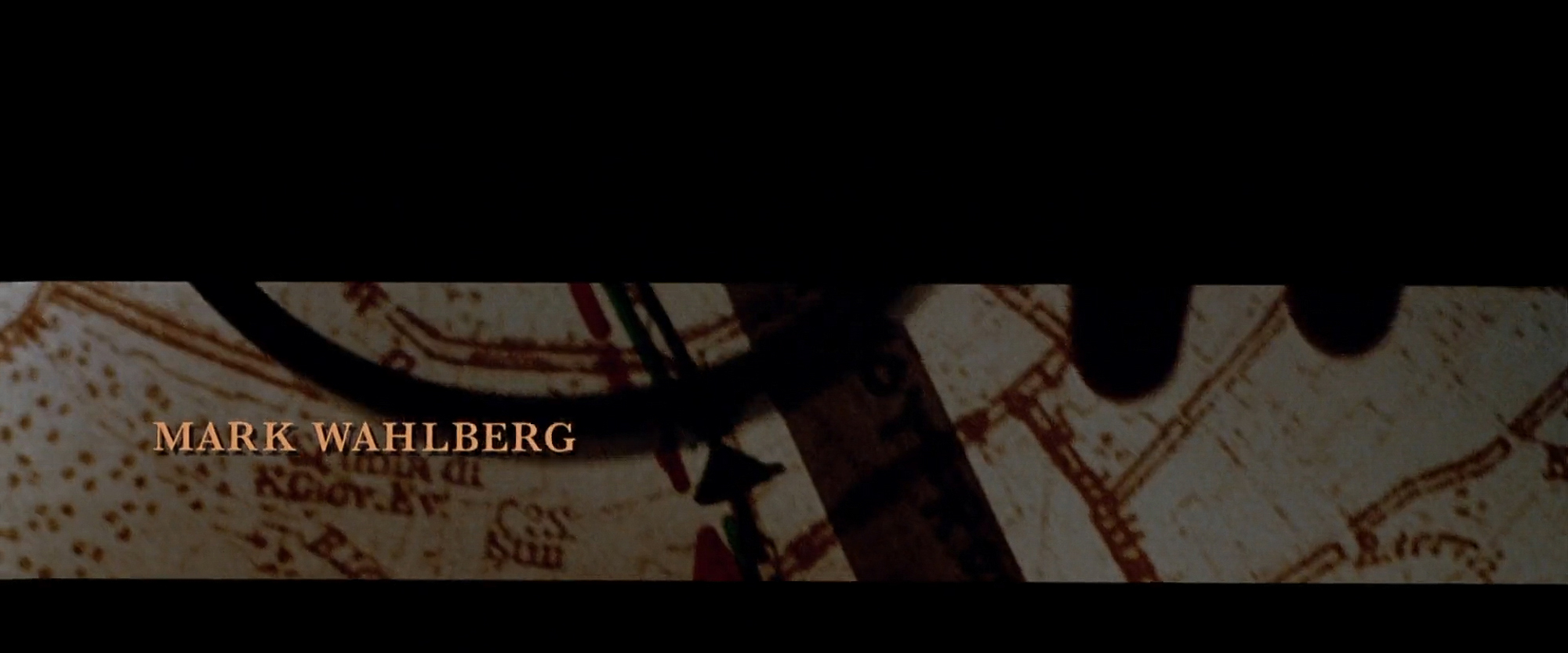 Cast title card over a hand-drawn map with ruler and markings