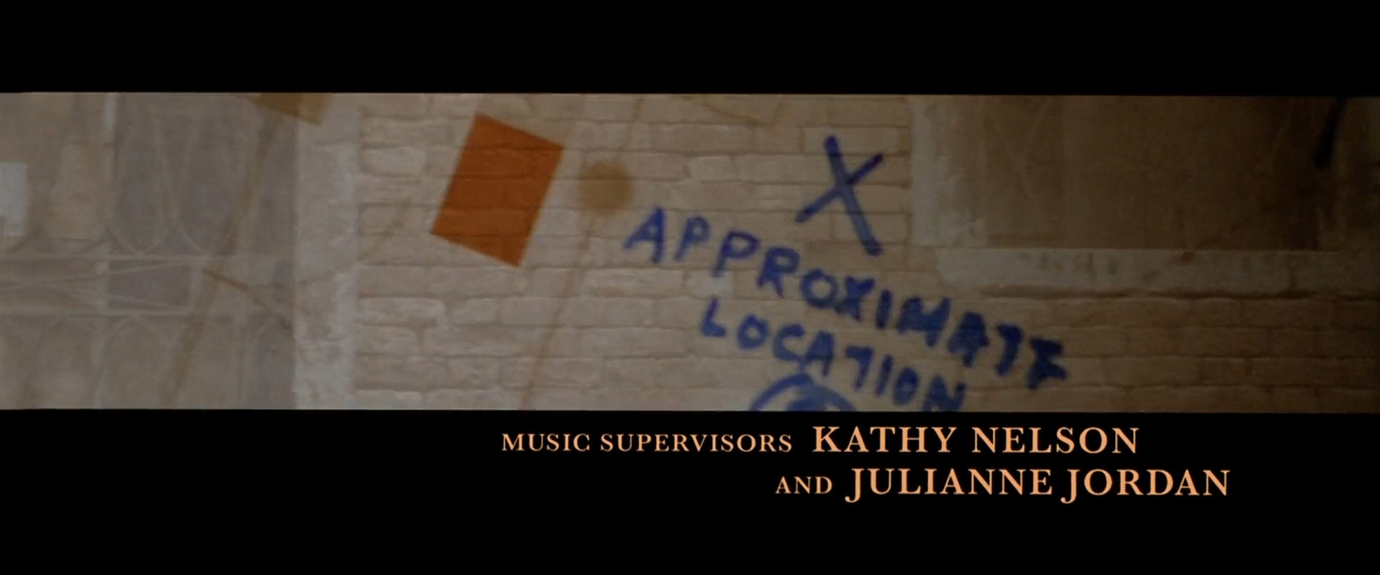 Title card over a drawn wall with handwritten location markings