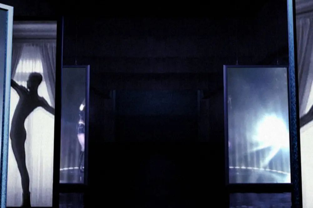 Silhouetted dancer framed in glowing panels
