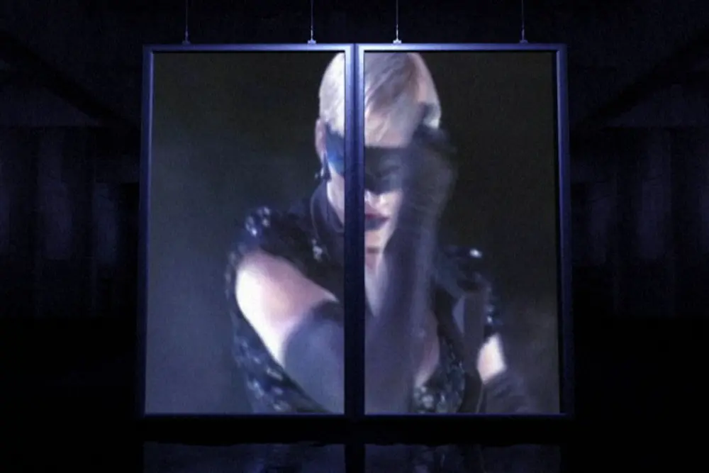 Split double-panel screen hanging in the dark hall
