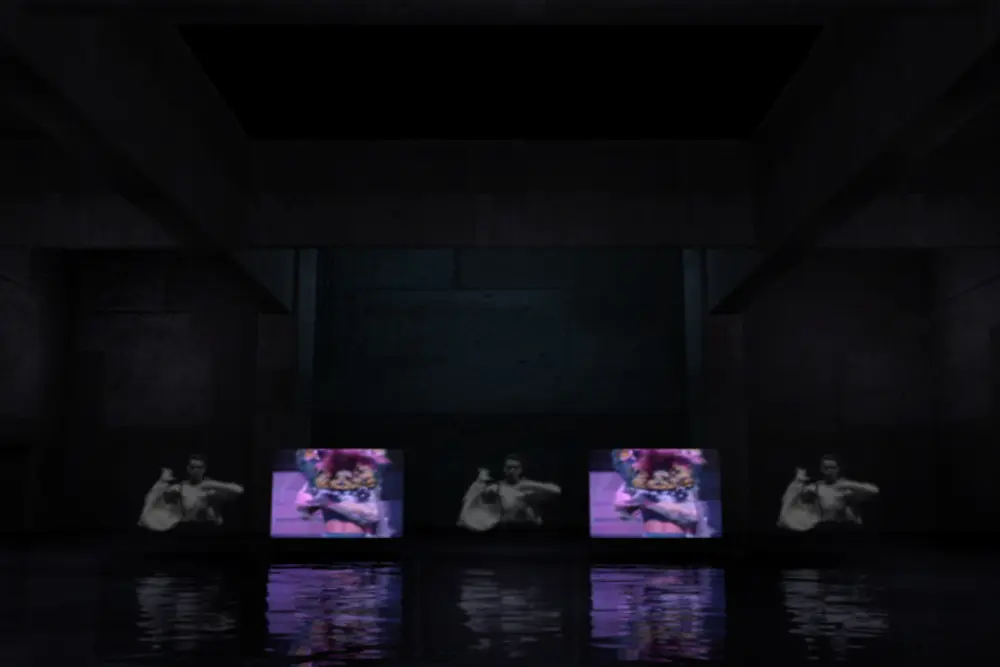Screens reflecting in the water floor of the CG hall
