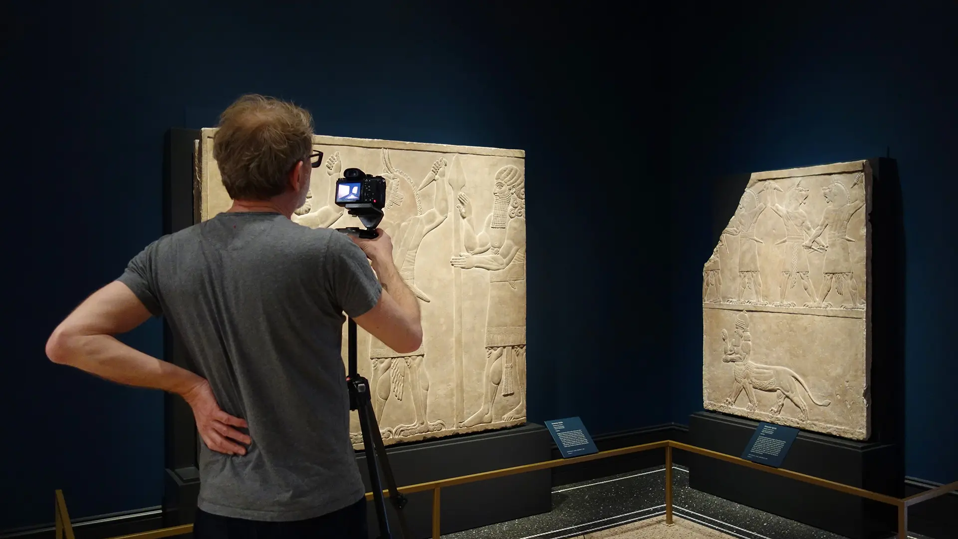 Photographing an Assyrian tablet in the gallery