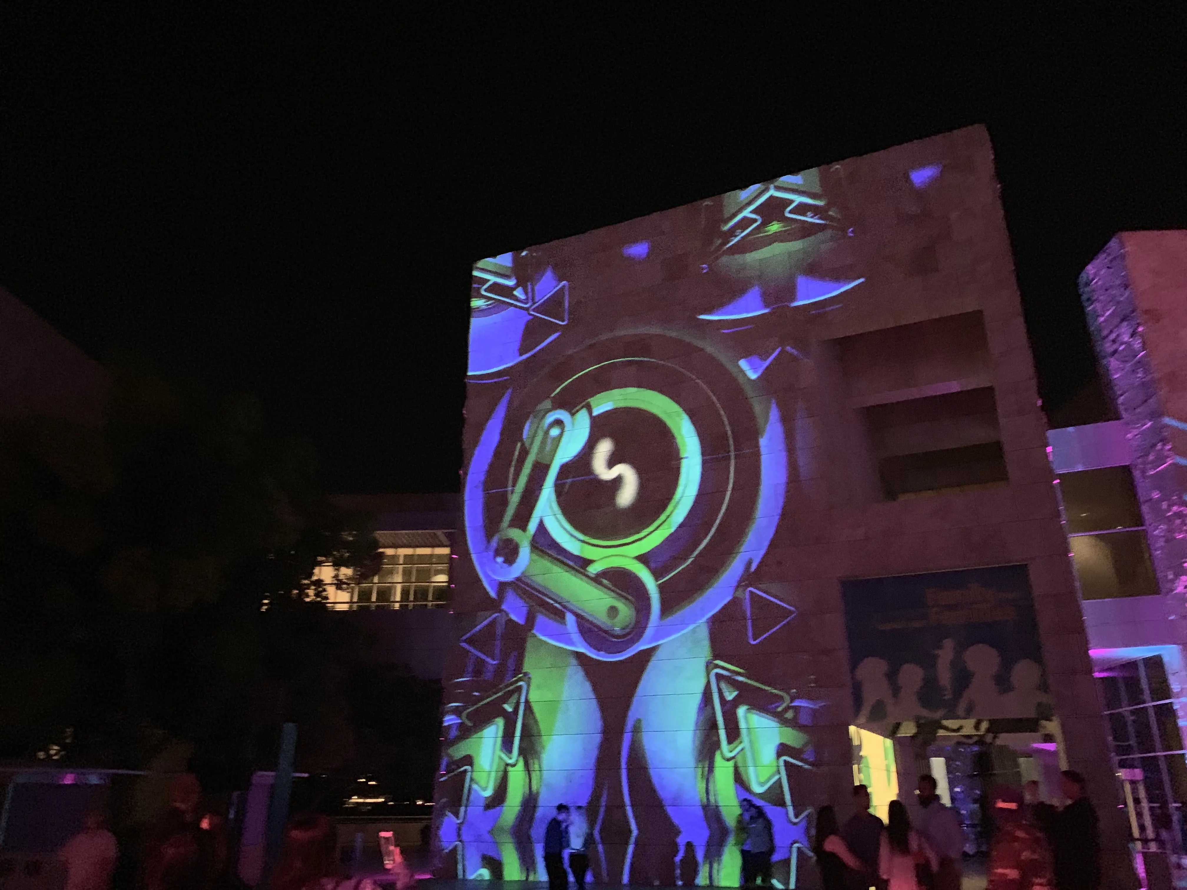 Projection-mapped boulder in the fountain pool