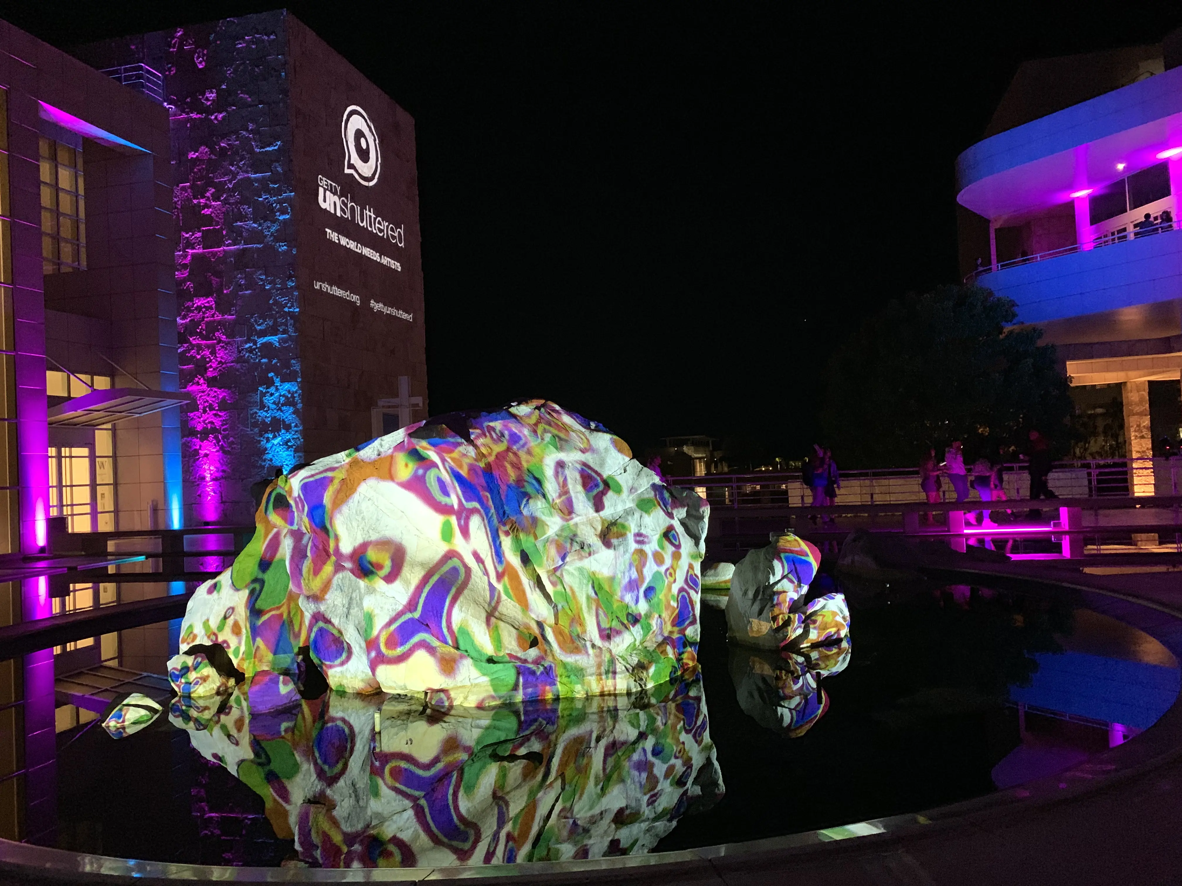 Boulder projection reflected in the pool
