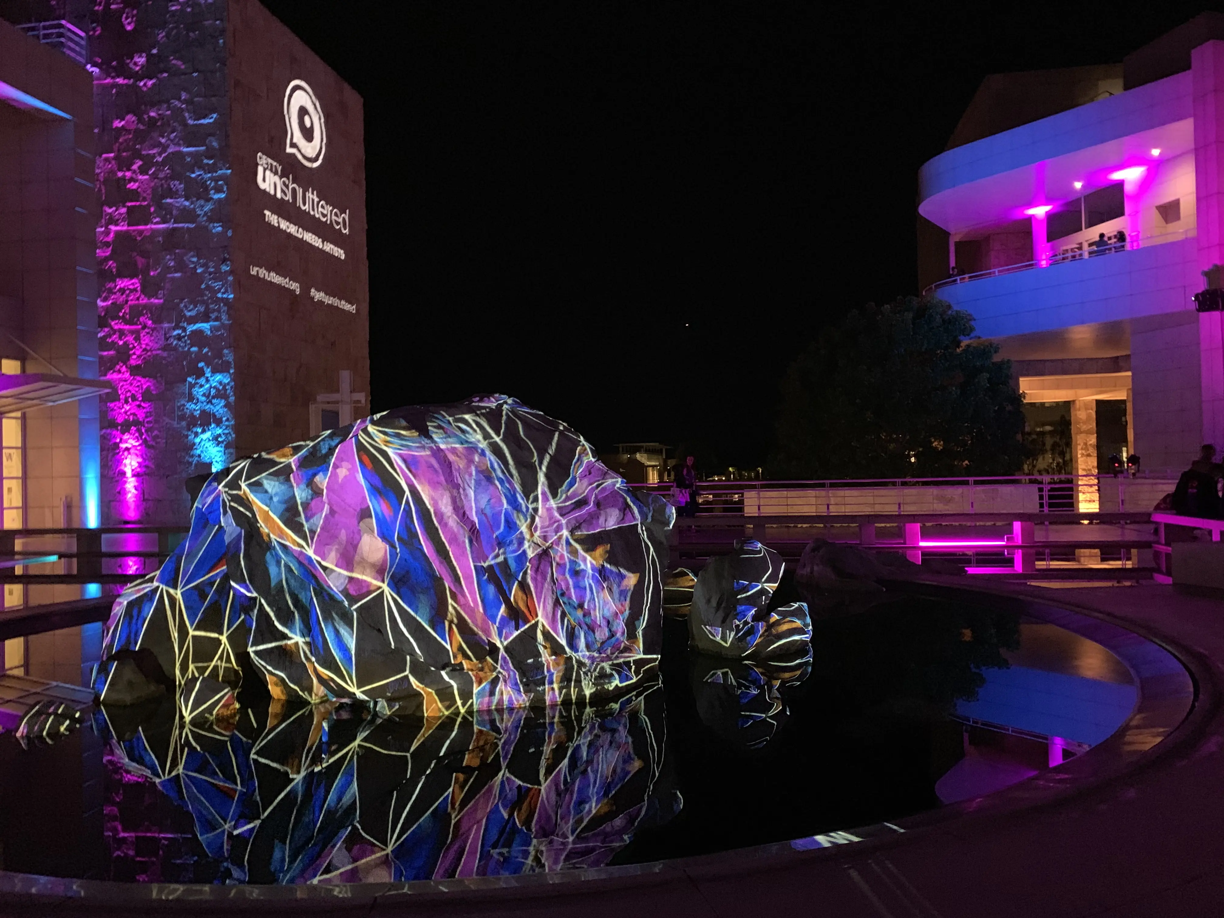 Faceted projection pattern on the fountain boulder