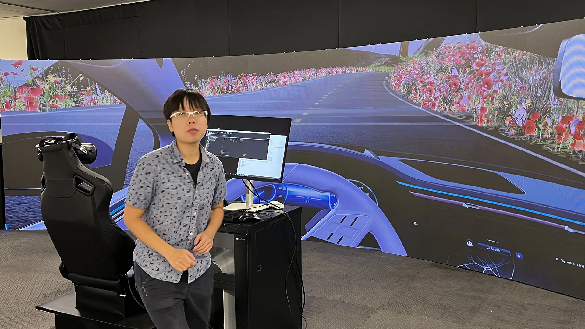 Driving rig in front of the large curved LED wall