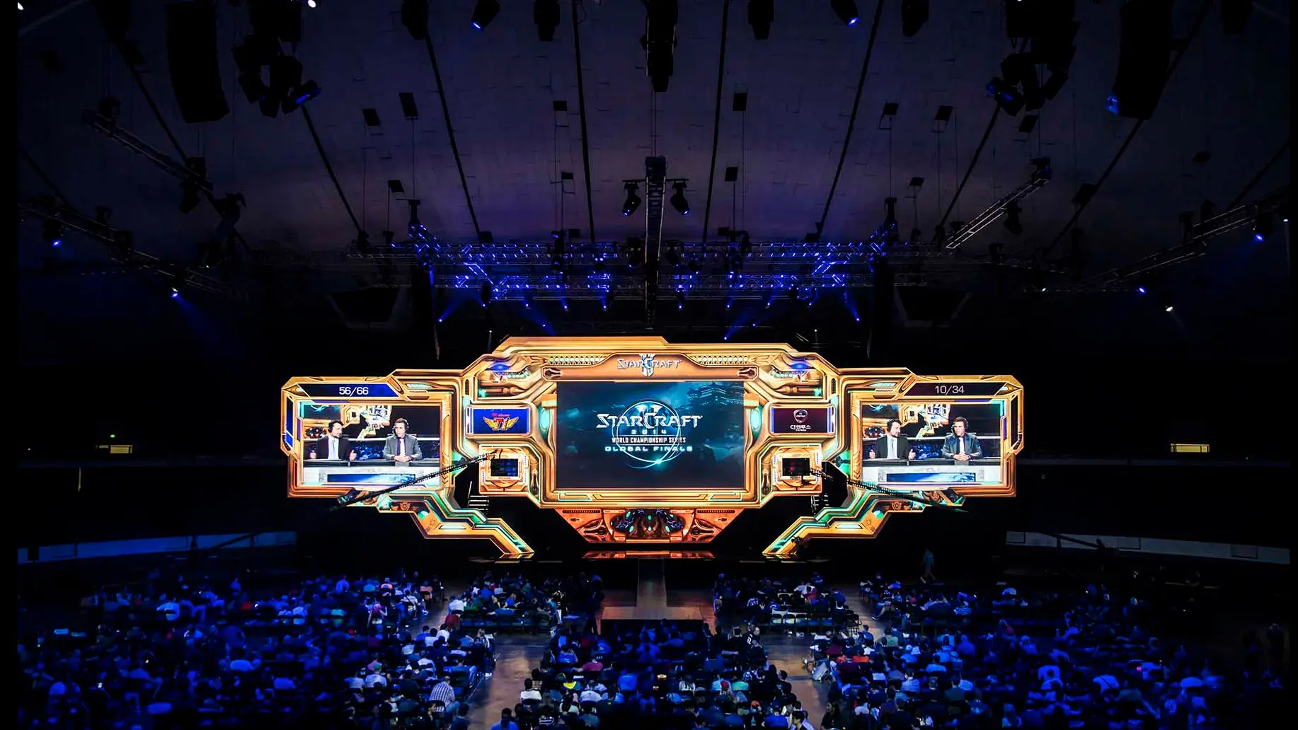 The StarCraft II stage lit in the Protoss look in front of a full arena